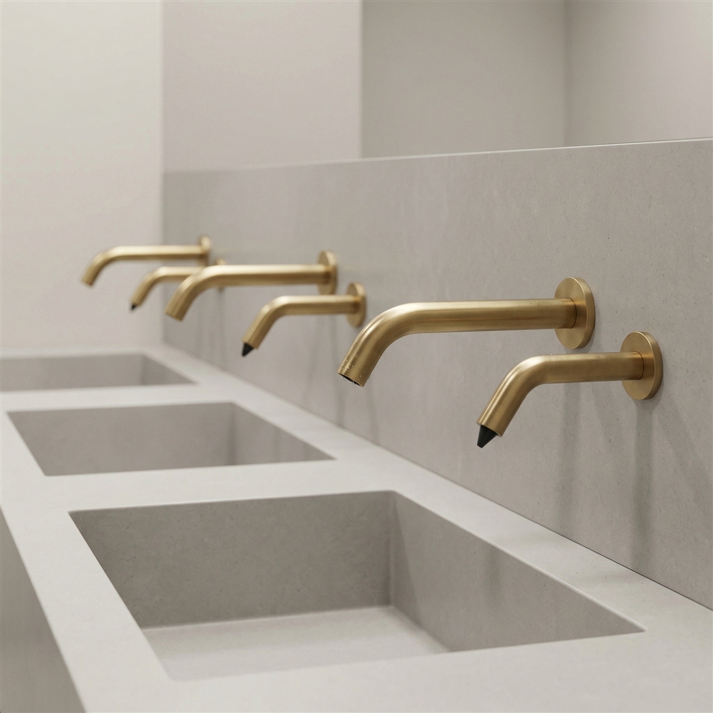 Close-up of infrared touchless faucet sensor technology in a luxury restroom
